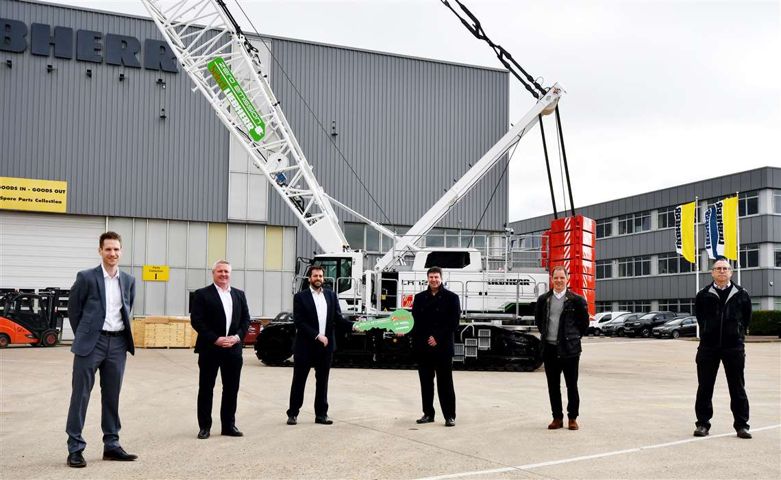 People from Select Plant and Liebherr GB at the handover in front of the new electric crawler crane in Select's white livery