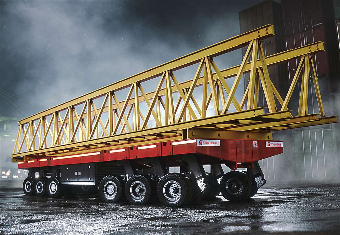 Six axle module of red PowerHoss carrying a yellow lattice section