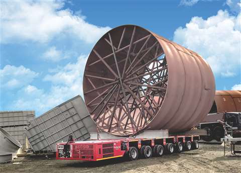Red Goldhofer Stepstar trailer carrying large cylindrical load