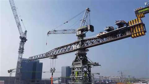 Zoomlion W12000 450 flat top tower crane with the 32 tonne luffer on top sprouting from the tower top