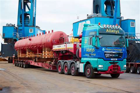 Red oxide colour tank on a red trailer with Allelys four axle MAN tractor