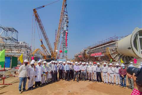 Line up of people in front of a crane prior to lifting