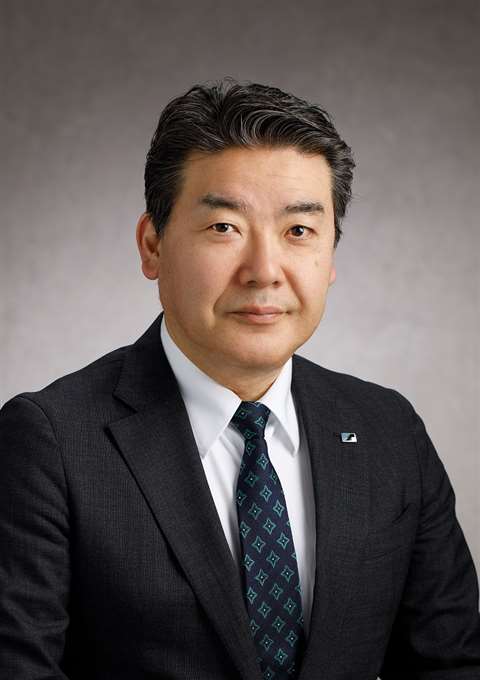 kenichi sawada in a suit and tie
