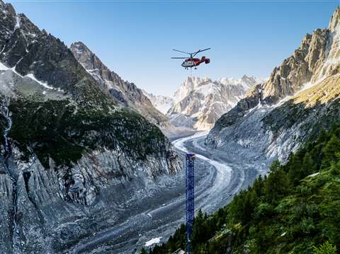tower crane in french mountain assembled by helicopter