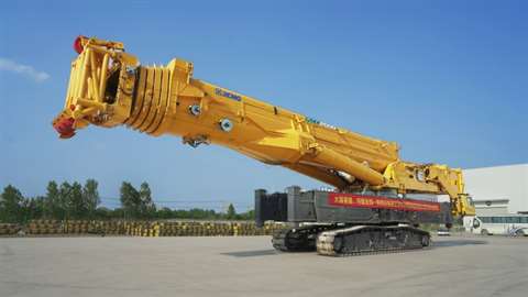 big yellow narrow track telecrawler crane at the factory