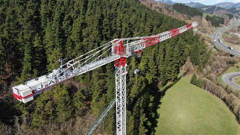 Aerial view of the new Jaso J800.48 low top tower crane on test in Spain, painted red and white