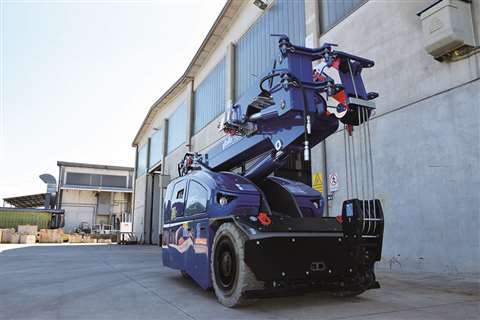 Valla’s eight-tonne capacity V80R electric pick and carry crane in blue outside a factory